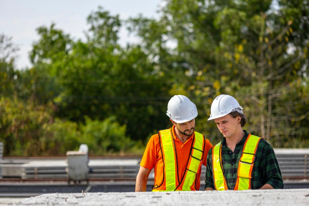 Construction team reviewing near-term work for a two-week look-ahead schedule on site