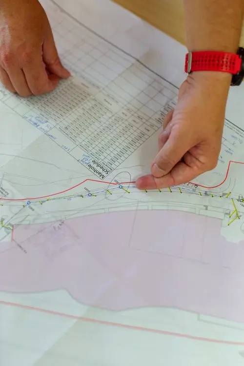 Planning engineer organizing records for a construction delay event chronology